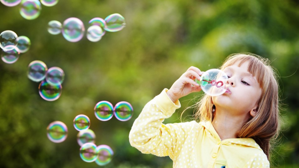 Girl blowing bubbles