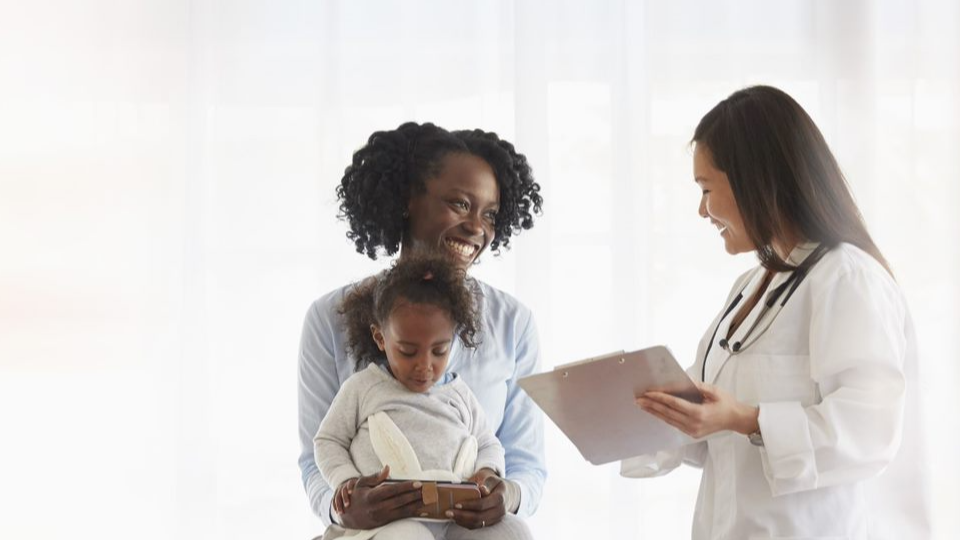 Mom and child with doctor