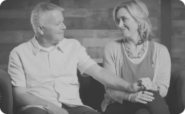 Couple Holding Hands Looking at Each Other