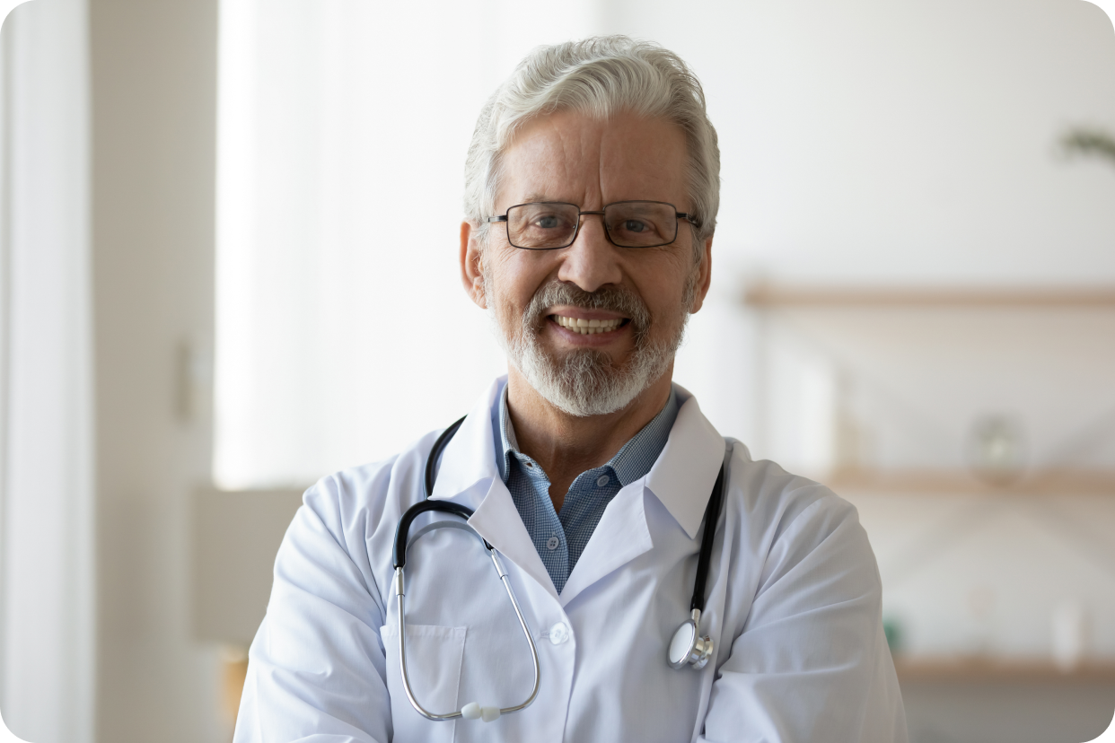 Doctor in office smiling