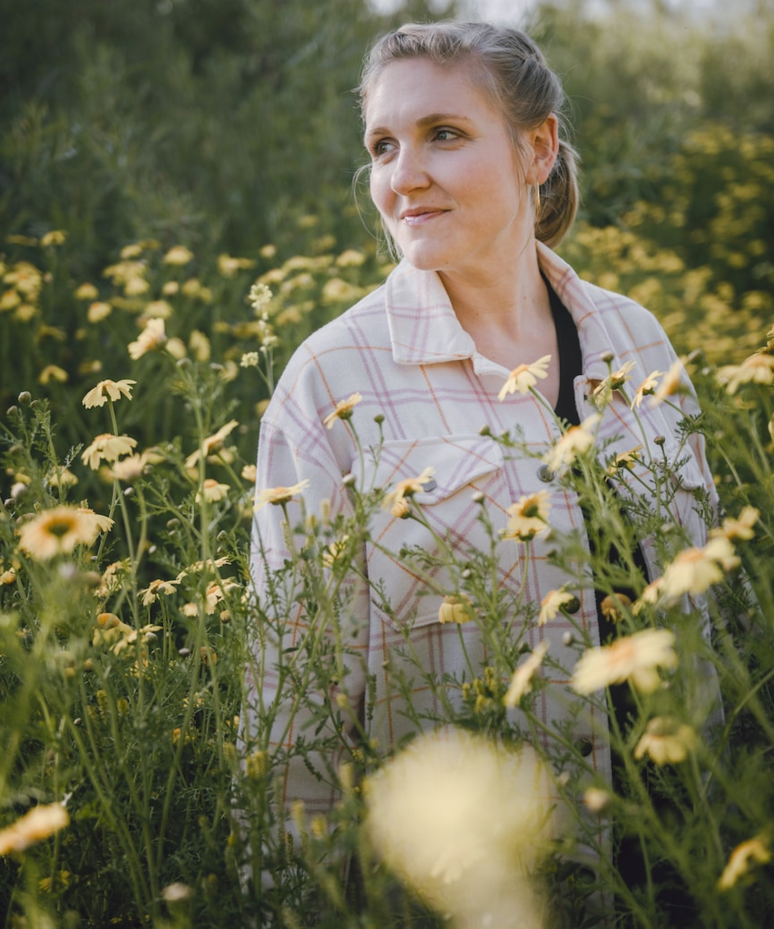 Woman in field of flowers